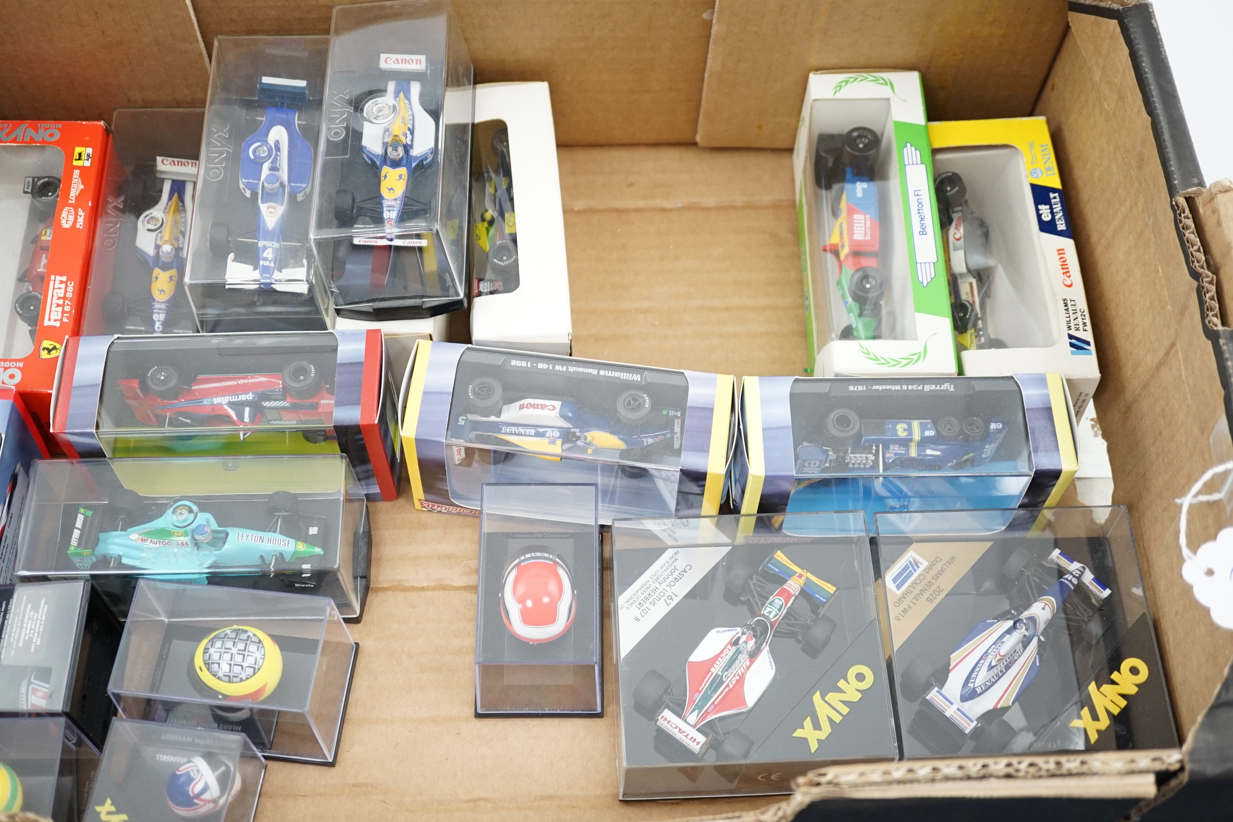 Thirty-seven boxed diecast motor racing related models by Onyx, Atlas Editions, etc. including 1:43 scale Formula One racing cars, models of helmets of famous drivers, etc.